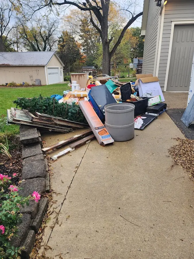 Dumpster being loaded with debris for Residential Dumpster Rental in Halfmoon